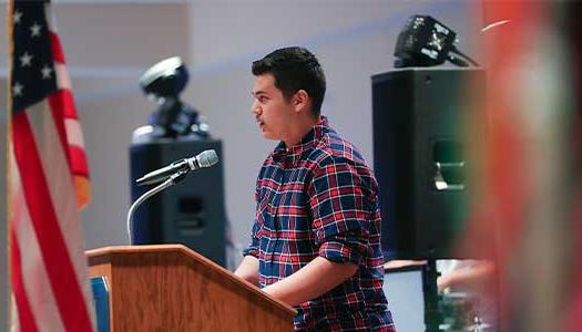 a student speaks at the Hispanic heritage month celebration